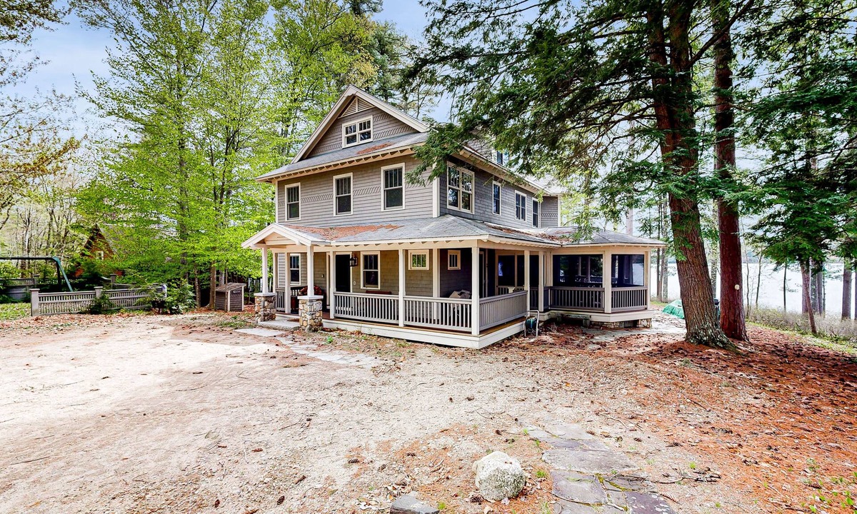 Meredith House | Captivating waterfront home with private dock & beach, lake views