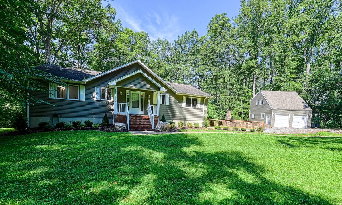 Livingston House | Lakefront home with deck, hot tub, game room, kayaks, & fireplace