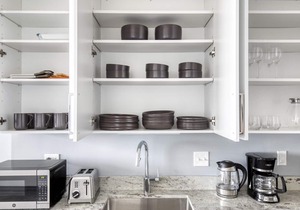 Premium Logan Square 1BR w/Roof Deck & Gym, 1 block to L, by Blueground