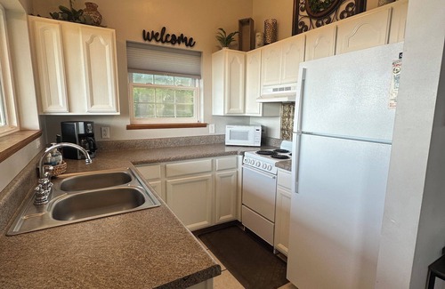 Cobden Cabin | Exquisite views of Shawnee National Forest seen from a private, covered hot tub.