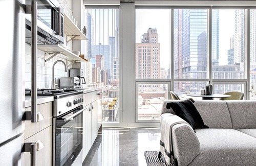 Near North Side Apartment | Mod River North 1BR w/Gym, Pool, near L stop & Beach, by Blueground