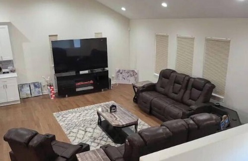 Oak Lawn House | A cozy bedroom in a home with high-tech amenities