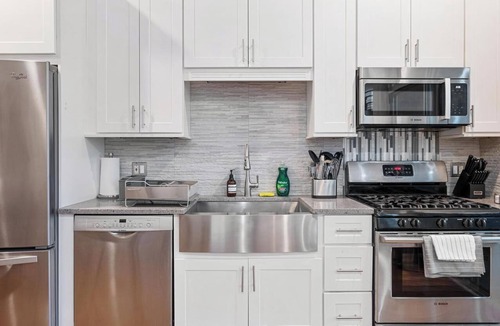 Near West Side Apartment | Balcony, Gym, 1 Garage Parking, Sleeps 10!