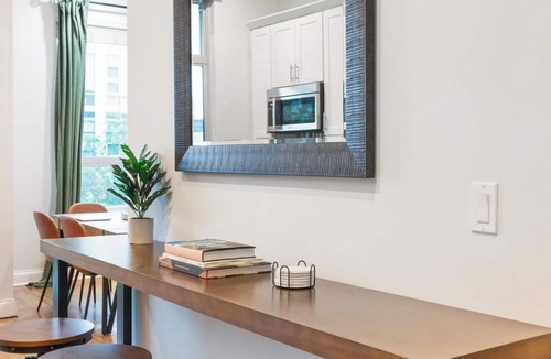 Near West Side Apartment | Balcony, Gym, 1 Garage Parking, Sleeps 10!