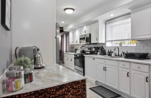 Belmont Cragin Apartment | Belmont Pleasures - hot tub/arcade gaming room