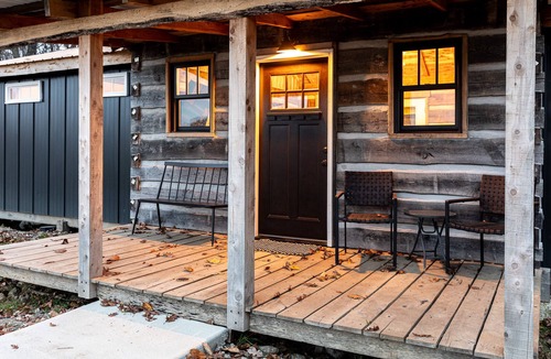 Sunnyland Cabin | Cabin Just Built! features two covered decks, living room, fireplace, kitchen