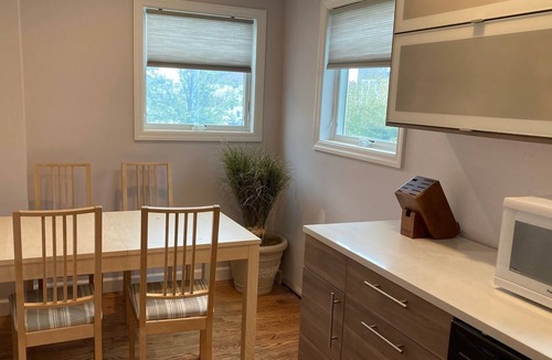 Lido Beach House | Charming canal-front apartment with dock & kayak, walk to restaurants and beach