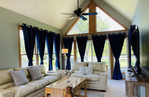 Channel Lake Cottage | Cozy Lake Front Getaway! Views/Fishing/Dogs Welcome/Skiing/Kayaks/Huge Yard!