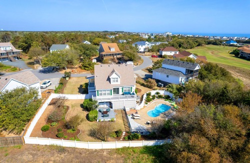 Sea Scape House | Entire home in Kitty Hawk, NC. Pool, hot tub, & spacious backyard!