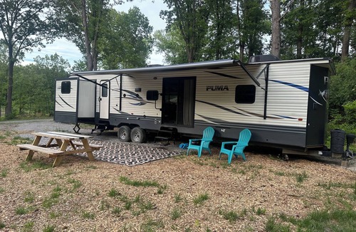 Carterville RV Rental | Experience Glamping in style. Private Lake - Pet Friendly!