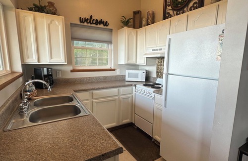 Cobden Cabin | Exquisite views of Shawnee National Forest seen from a private, covered hot tub.