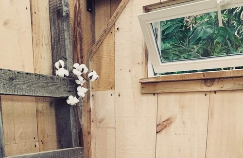 Boscawen RV Rental | Handcrafted, off-grid, no electricity-rustic-lux camping cabin w/running water.
