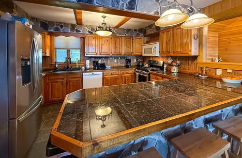 Rome House | Inviting Lakeside Home with direct dock access, patio seating, and gas fireplace