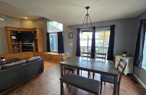 Marion House | Lake Front home Sleeps 10 Overlooking deck for perfect lake views & a coffee bar