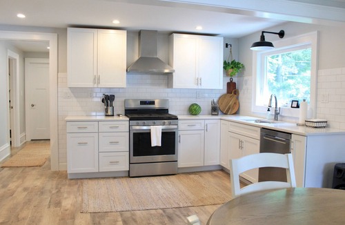 Effingham House | Lake Sara cottage: 3BR/2BA, hot tub, swim dock, firepit, kayaks, & lake views!