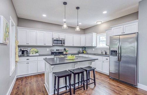 Linn Valley House | Lakefront, private swim dock, kayaks, paddleboards, grill, 1 hour from KC.
