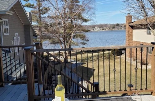 Rapids City House | Luxury river front two-bedroom carriage house with private deck and hot tub.