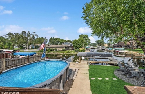 McHenry House | Peaceful and Relaxing Water Front Home with Outdoor Pool Sleeps 12