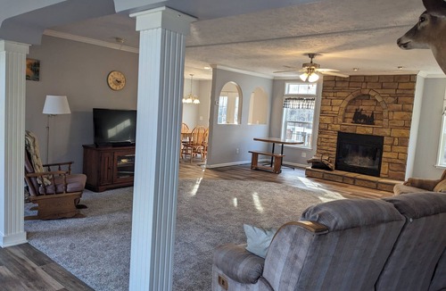 Bluford House | Relax at Woodland Country Lodging, surrounded by the beauty of nature.