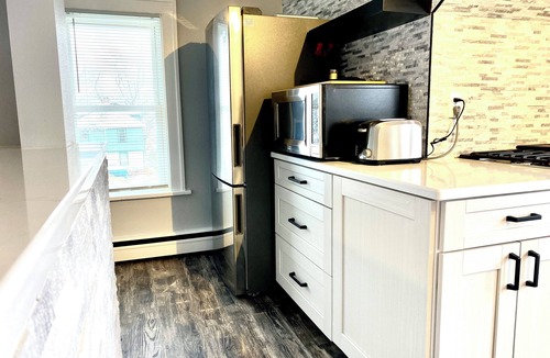 Rockford House | Rockford 2BD w/EV Charger, Patio & Fast WiFi, Upscale Furnished Rentals in Rockford, IL | Ideal Sho