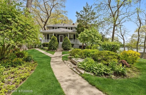 Channel Lake House | Serene lakefront house with expansive deck and pier