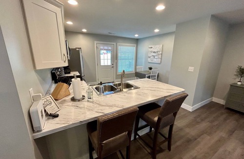 Quincy House | Serene & Modern Oasis - Newly Built, Attached Garage, Centrally Located