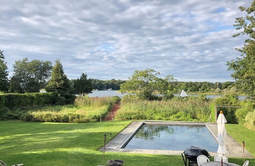 Noyack House | Stunning Waterfront Home with Pool, Boat Dock, and Acre of Land
