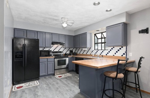 Collinsville House | Touch of Class 3-bedroom townhome in Belleville King Bedroom.