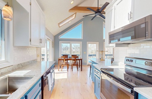 Livingston House | Updated lakefront home & studio with water views, hot tub, dock & game room