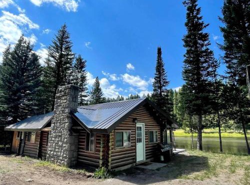 Charming Riverfront Cabin with Hot Tub and Dock Access Near Scenic Trails in Island Park, Idaho