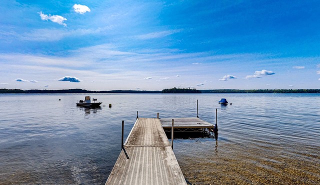 Dog-friendly beach home on Green Lake with views, fireplace, dock, canoe & kayak