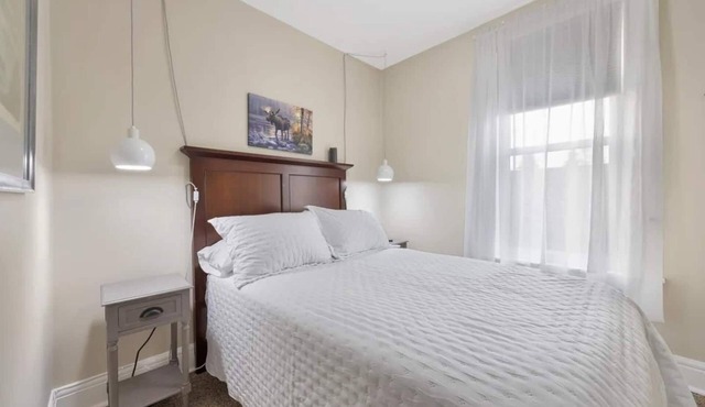 Experience a refined retreat at this elegant apartment situated in the vibrant center of downtown Two Harbors, Minnesota.