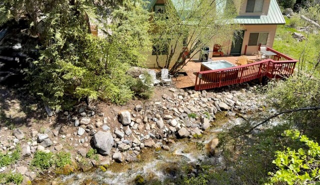 Quiet streamside retreat Hot Tub Deck overlooking the creek Wood-burning Fireplace insert Tucked below Sundance