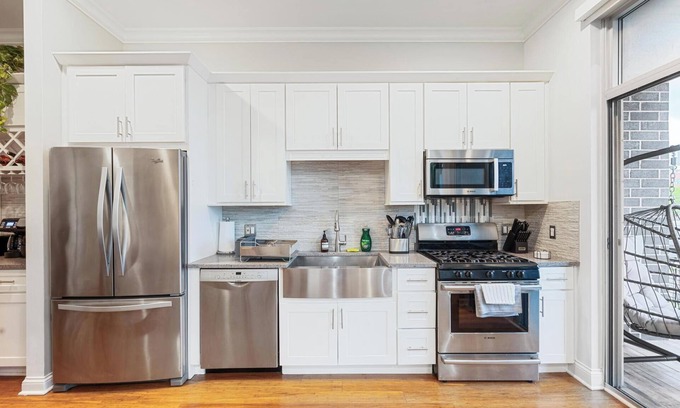Near West Side Apartment | Balcony, Gym, 1 Garage Parking, Sleeps 10!