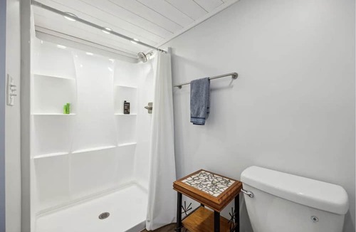 Forest Park Apartment | City-Accessible Basement Retreat